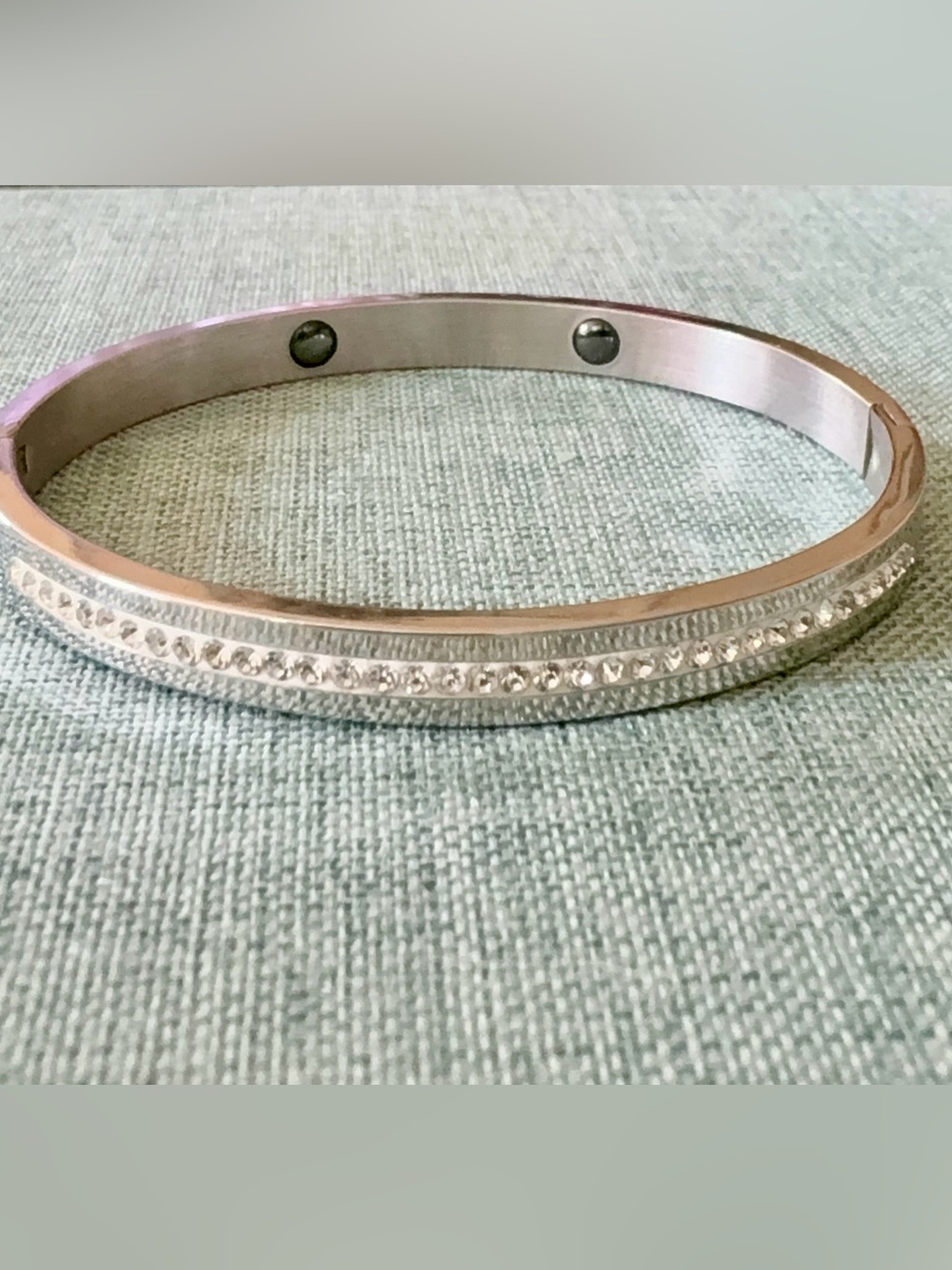 Elegant Hinged cuff bangle bracelet with a row of sparkling crystals.